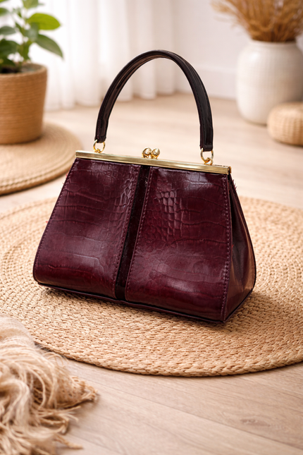 Women's maroon handbag with a crocodile skin