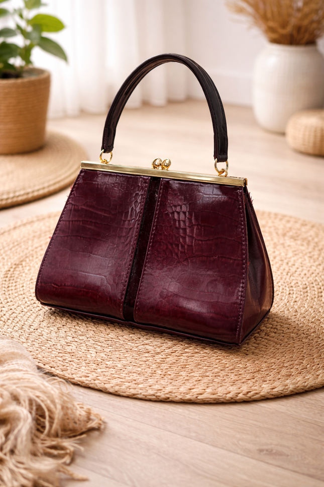 Women's maroon handbag with a crocodile skin