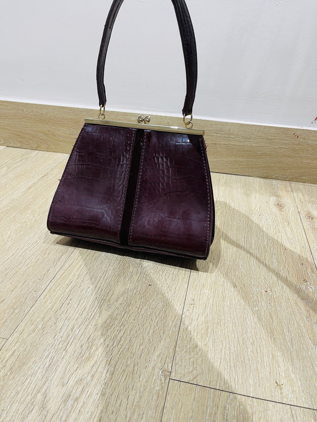Women's maroon handbag with a crocodile skin