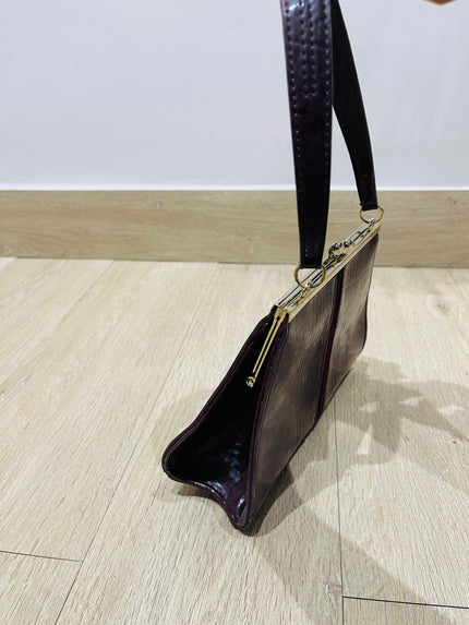 Women's maroon handbag with a crocodile skin