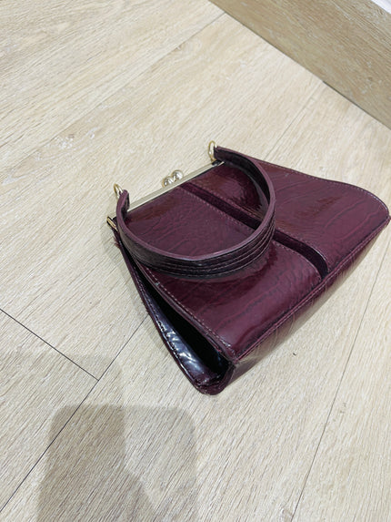 Women's maroon handbag with a crocodile skin